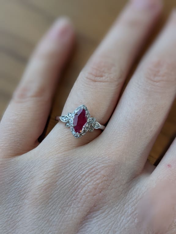 Oval diamond ring on hand