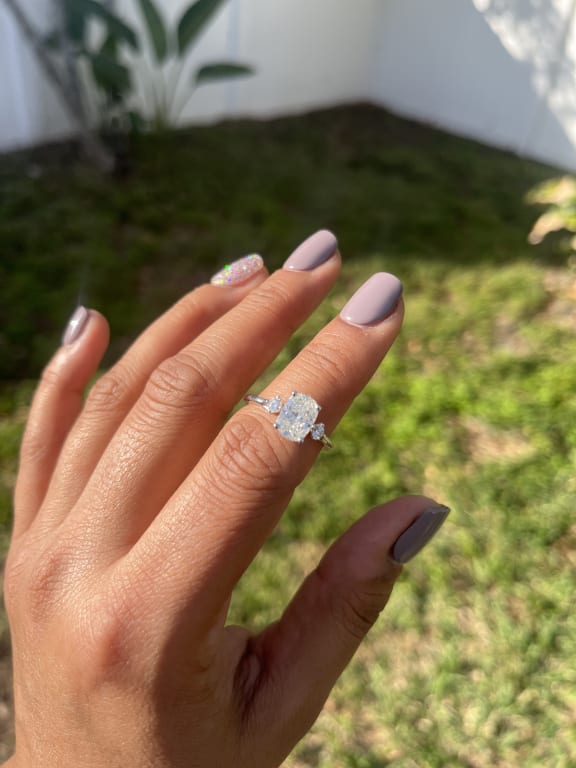 Oval diamond ring on hand