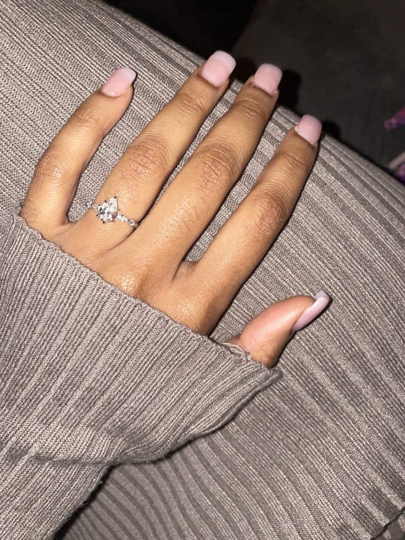 Oval diamond ring on hand
