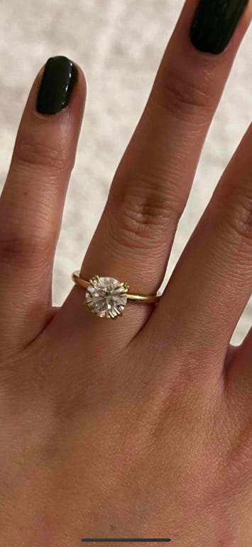 Oval diamond ring on hand