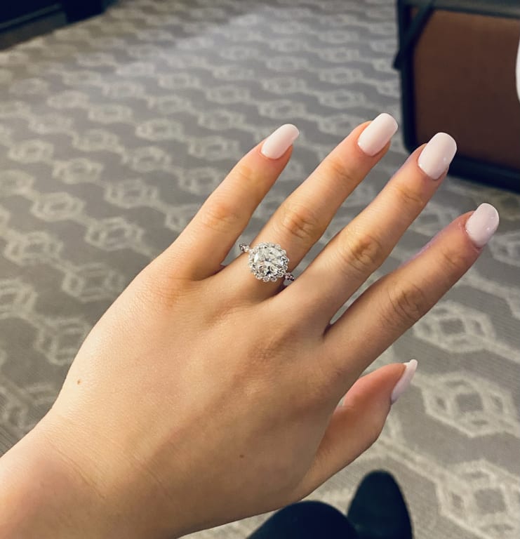 Oval diamond ring on hand