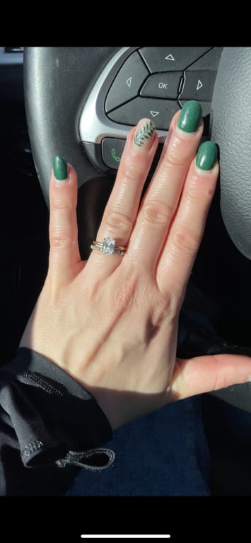 Oval diamond ring on hand