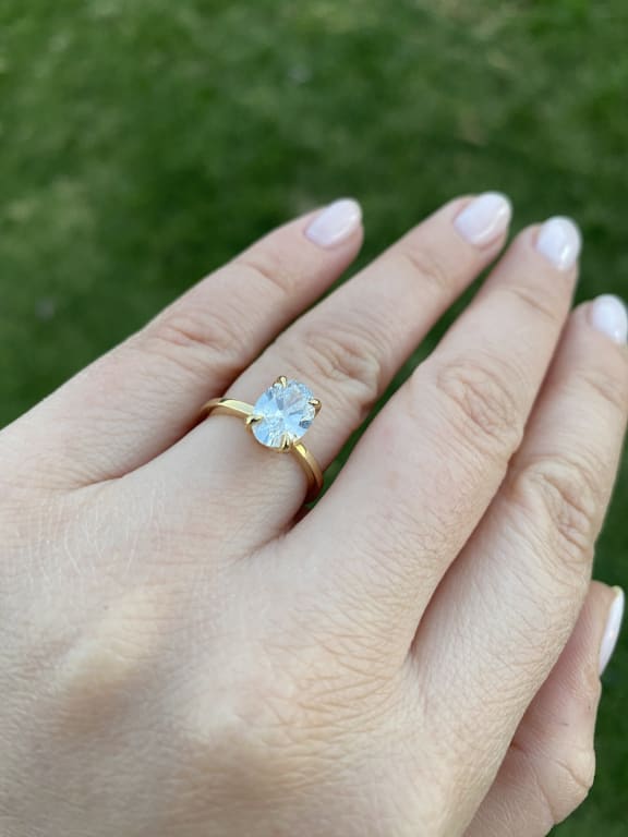 Oval diamond ring on hand