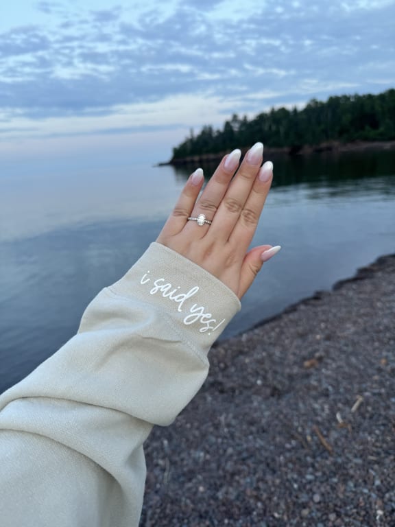Oval diamond ring on hand