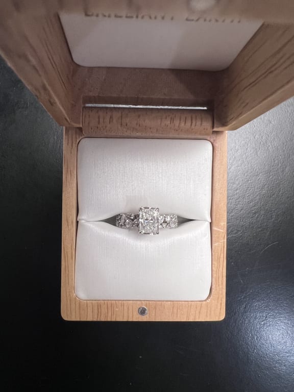 Oval diamond ring on hand