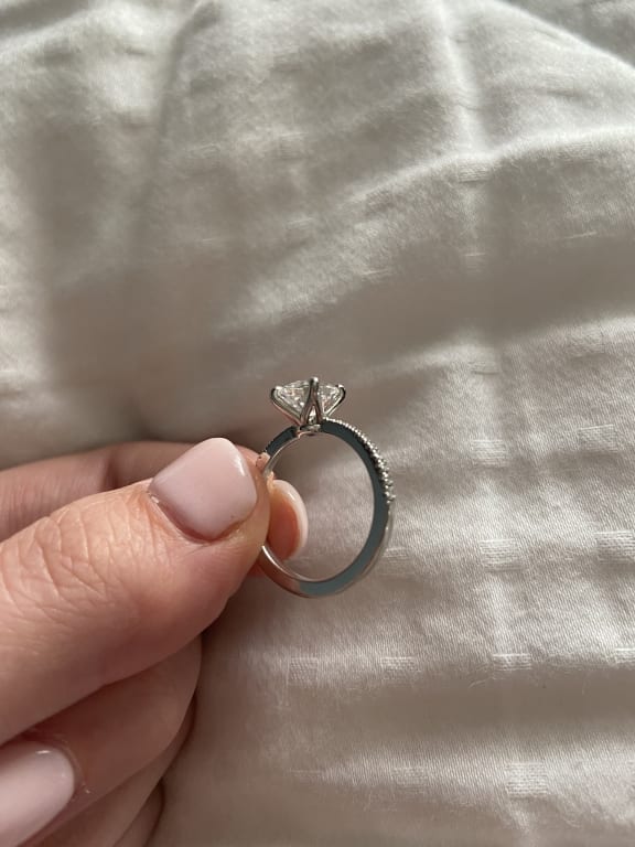 Oval diamond ring on hand