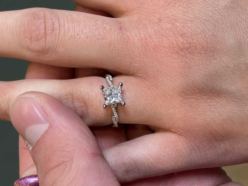 Oval diamond ring on hand