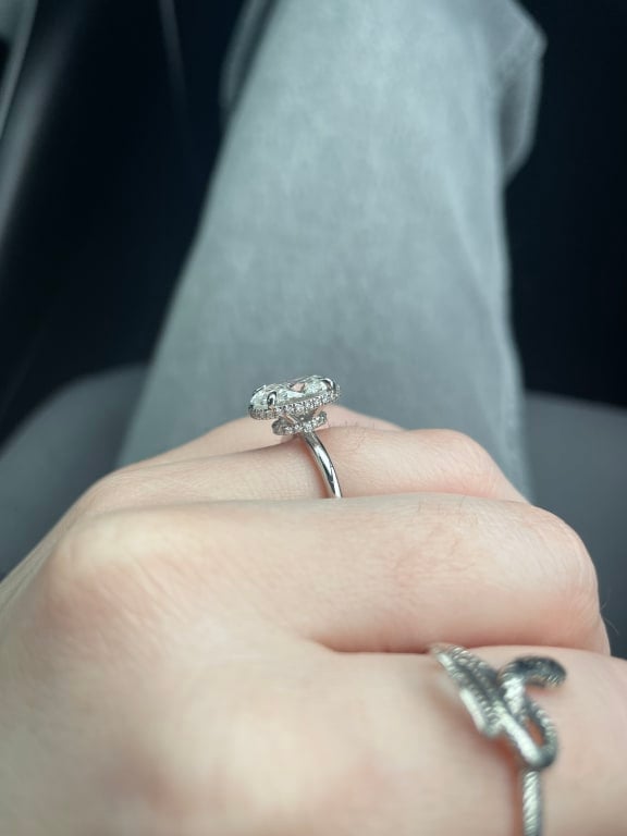 Oval diamond ring on hand