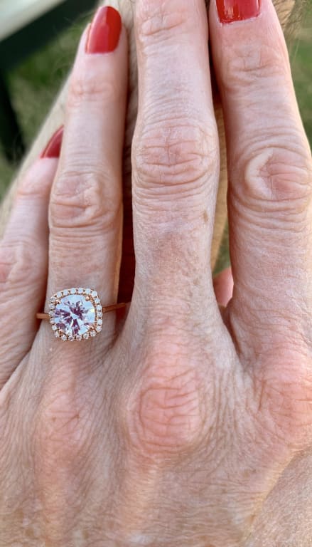 Oval diamond ring on hand