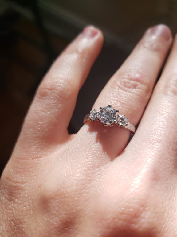 Oval diamond ring on hand