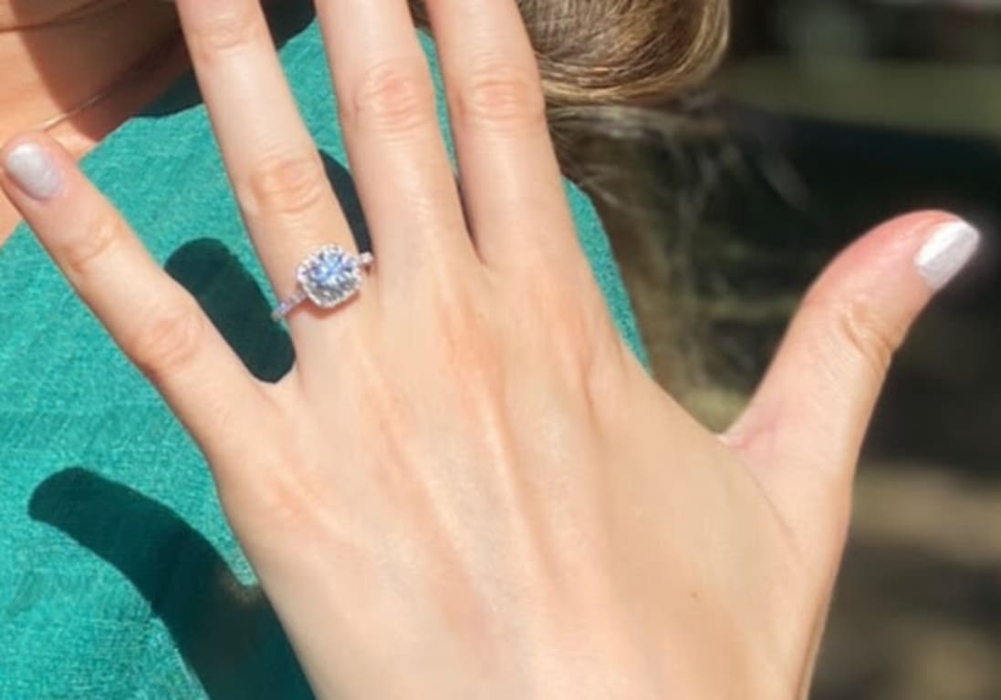 Oval diamond ring on hand
