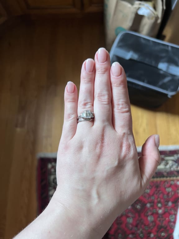 Oval diamond ring on hand