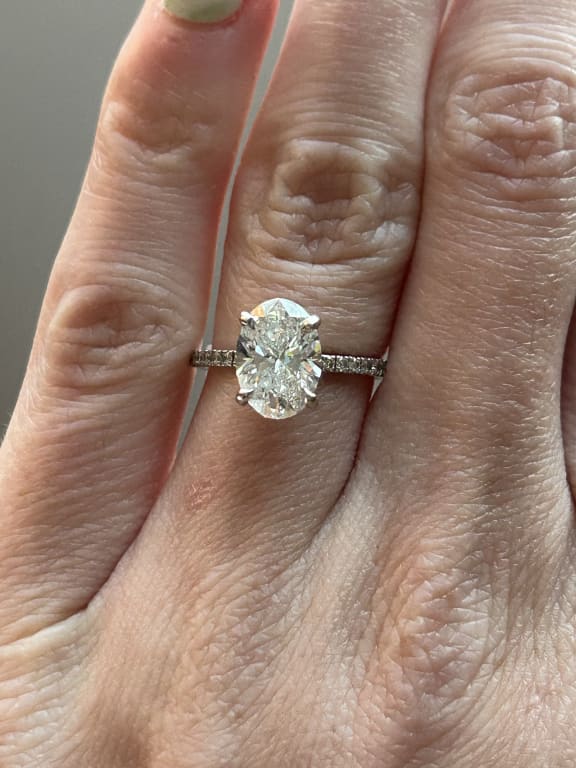 Oval diamond ring on hand