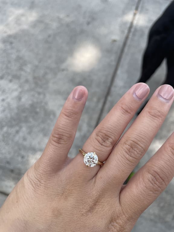 Oval diamond ring on hand