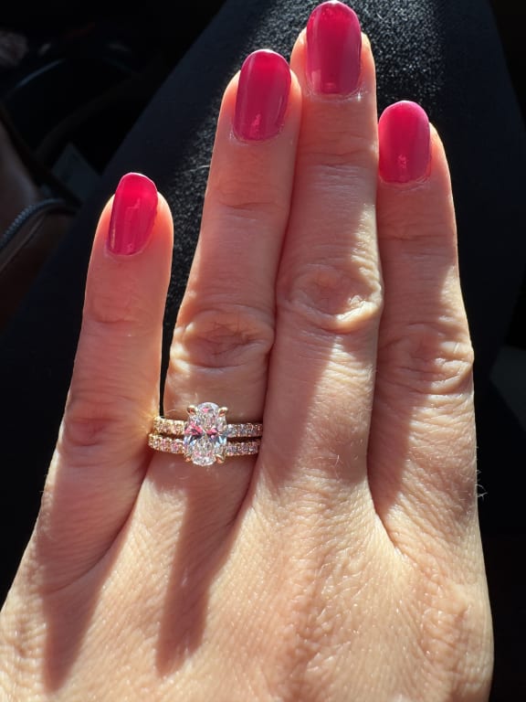 Oval diamond ring on hand