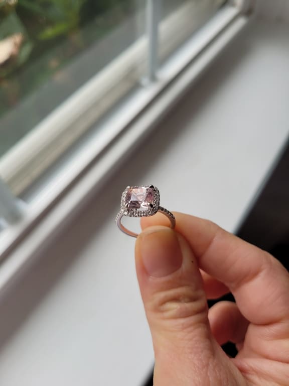 Oval diamond ring on hand