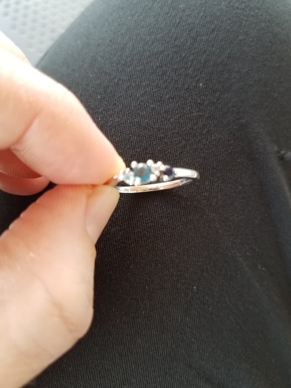 Oval diamond ring on hand