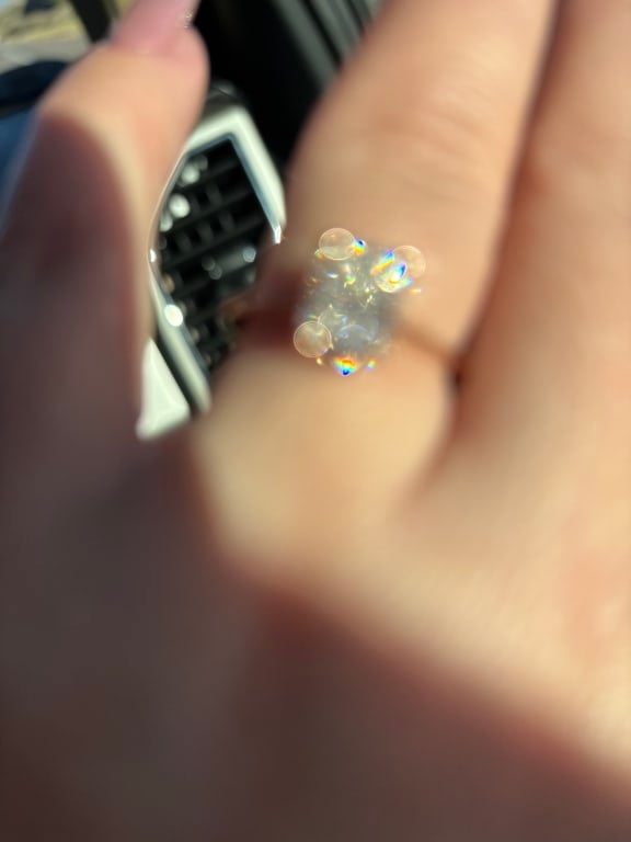 Oval diamond ring on hand