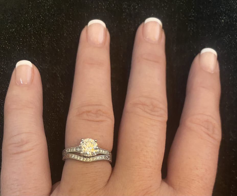 Oval diamond ring on hand
