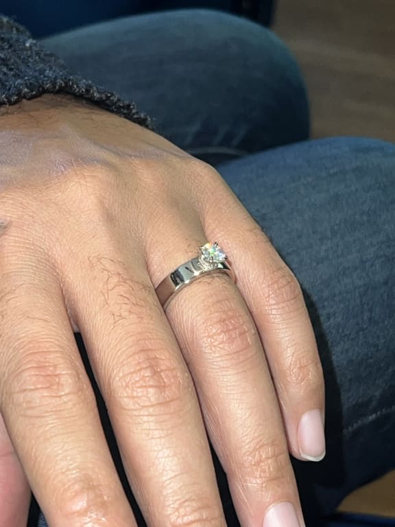 Oval diamond ring on hand
