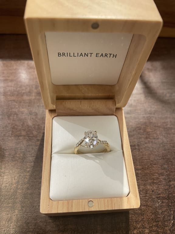 Oval diamond ring on hand