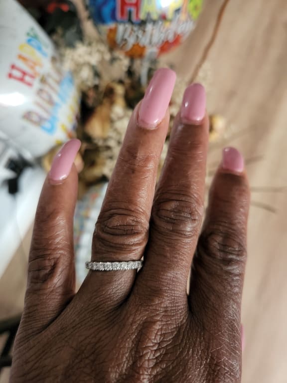 Oval diamond ring on hand