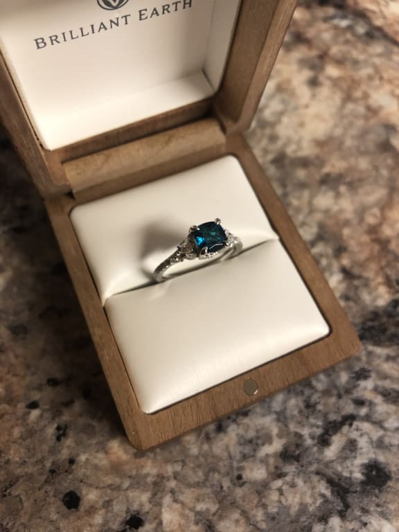 Oval diamond ring on hand
