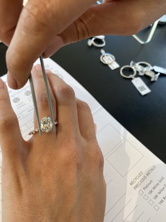 Oval diamond ring on hand
