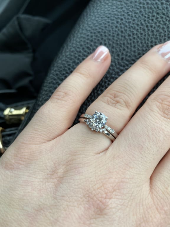 Oval diamond ring on hand