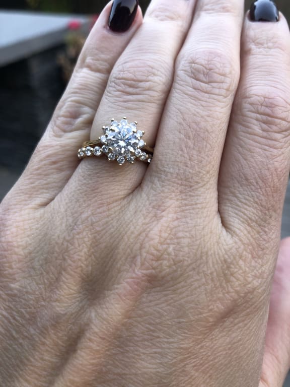 Oval diamond ring on hand