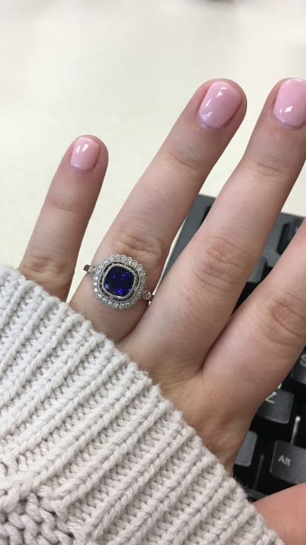 Oval diamond ring on hand