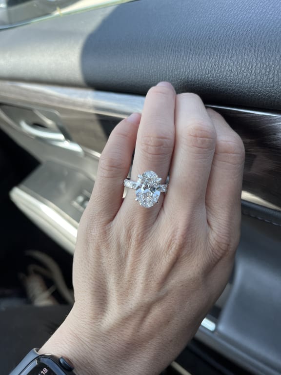 Oval diamond ring on hand