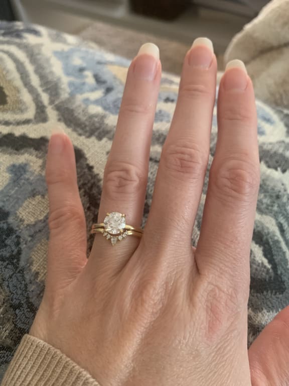 Oval diamond ring on hand