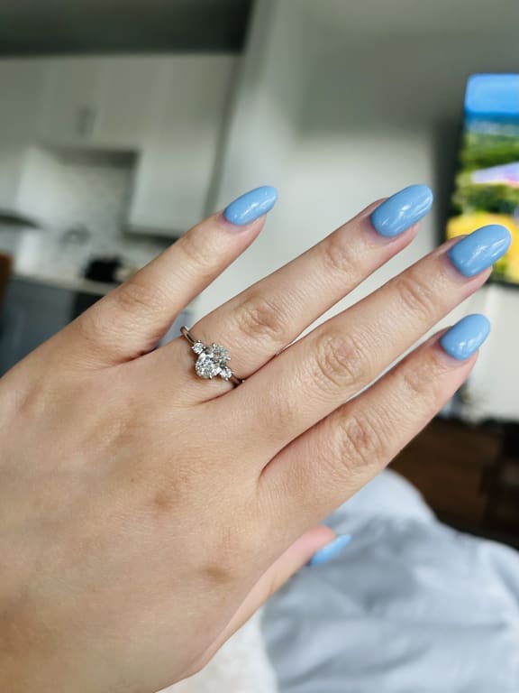 Oval diamond ring on hand