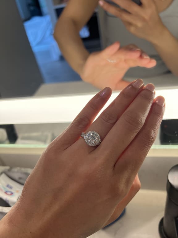 Oval diamond ring on hand