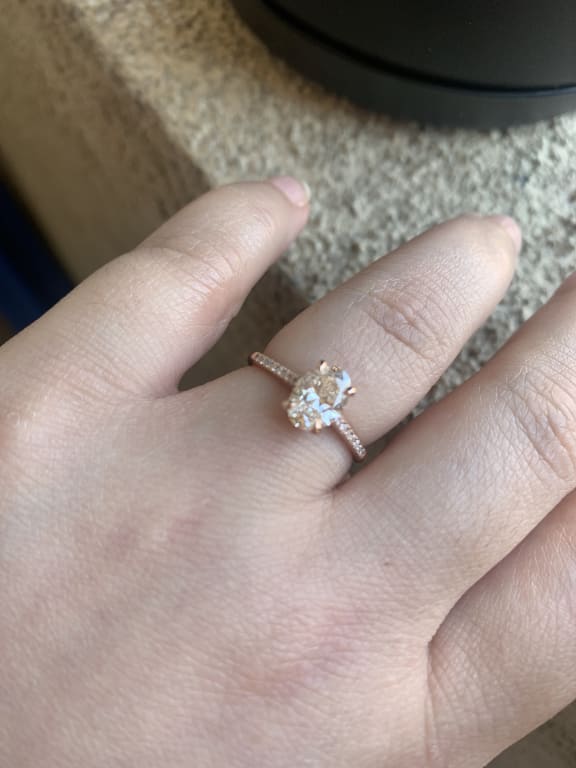 Oval diamond ring on hand