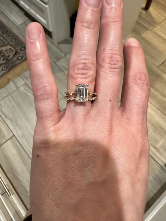 Oval diamond ring on hand