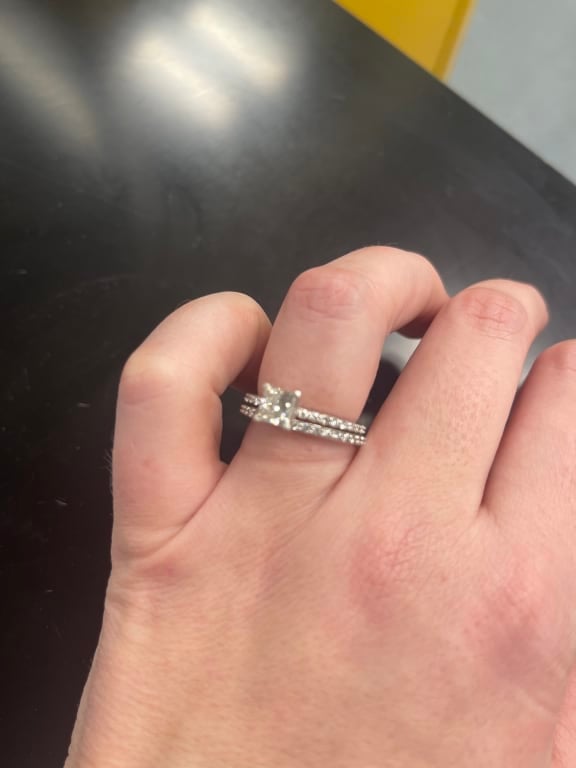 Oval diamond ring on hand