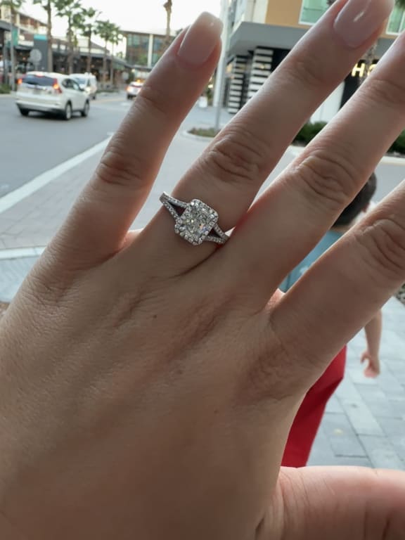 Oval diamond ring on hand
