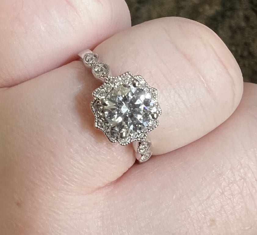 Oval diamond ring on hand