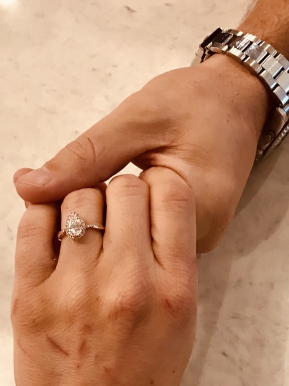 Oval diamond ring on hand