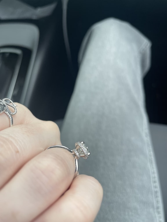 Oval diamond ring on hand