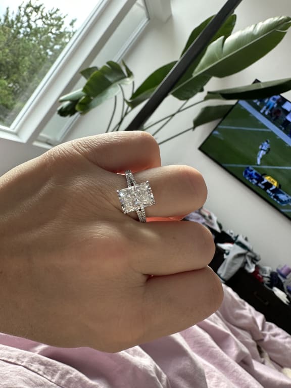 Oval diamond ring on hand