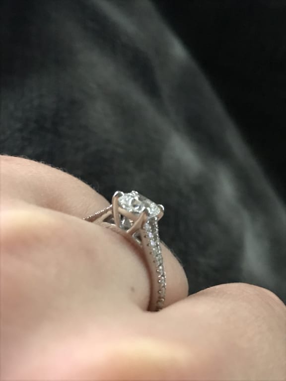 Oval diamond ring on hand