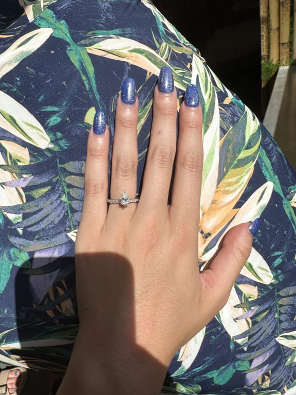 Oval diamond ring on hand
