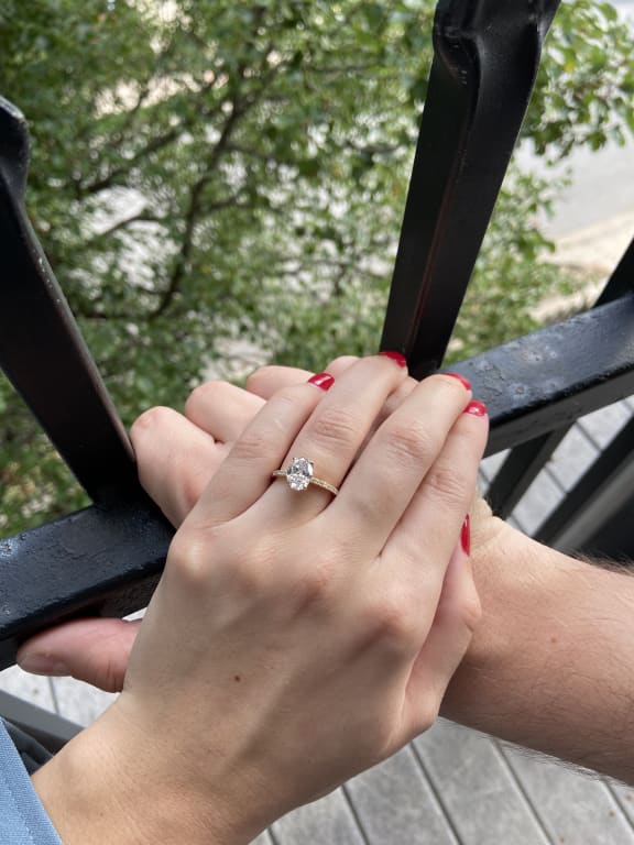 Oval diamond ring on hand