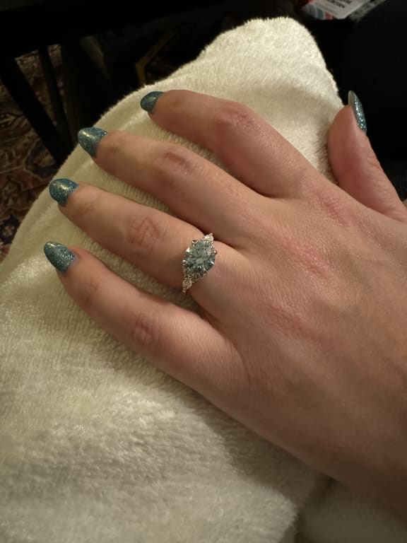 Oval diamond ring on hand