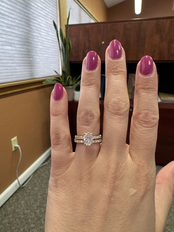 Oval diamond ring on hand