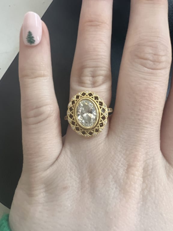 Oval diamond ring on hand