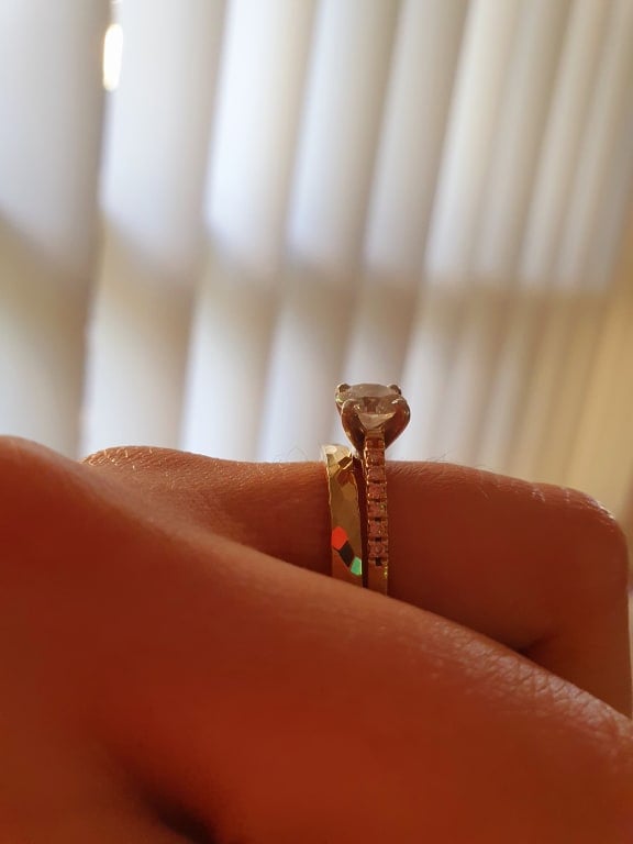 Oval diamond ring on hand